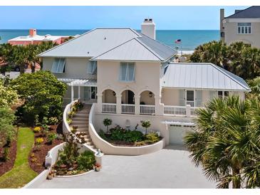 Stunning beachside home with a metal roof, manicured landscape, and gorgeous ocean views at 109 Pioneer Loop, Georgetown, SC 29440