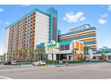 Brightly colored Landmark Resort exterior view showcases architecture and tropical landscaping in an inviting coastal setting at 1501 South Ocean Blvd. # 643, Myrtle Beach, SC 29577