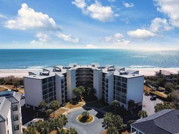 Gorgeous aerial view of ocean-front condo building with access to the beach and beautiful ocean views at 417 South Dunes Dr. # B16, Pawleys Island, SC 29585