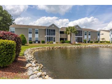 Beautiful condominium building overlooking the lush landscaped grounds and tranquil lake at 8887 Chandler Dr. # A, Myrtle Beach, SC 29575