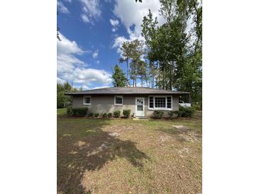 Charming single-story home featuring a well-maintained yard and metal roof at 972 Mount Carmel Rd., Hemingway, SC 29554