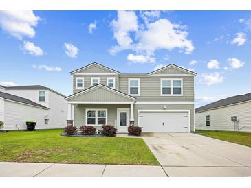 Charming two-story home with landscaped yard and inviting curb appeal at 1015 Saltgrass Way, Myrtle Beach, SC 29588