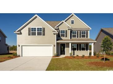 Charming two-story home with a well-manicured lawn, attached garage, and classic architectural details at 1231 Barrington Way, Conway, SC 29526