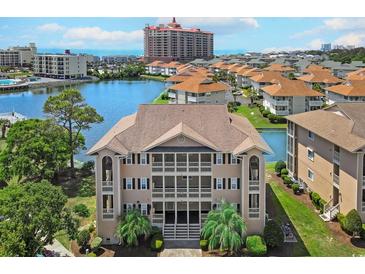 Beautiful three story condo building overlooking a tranquil lake and lush landscaping at 1900 Duffy St. # A8, North Myrtle Beach, SC 29582