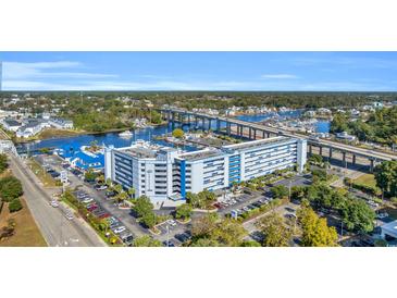 High-rise condo building with Intracoastal Waterway views, landscaped grounds, and parking at 2100 Sea Mountain Hwy. # 224, North Myrtle Beach, SC 29582