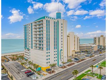 Beautiful exterior view of a beachfront resort with parking and scenic ocean views on a bright, sunny day at 2301 S Ocean Blvd. # 1202, North Myrtle Beach, SC 29582