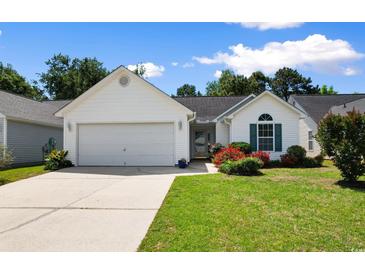 Charming one-story home with well-maintained lawn and colorful landscaping at 4591 Hidden Creek Ln., Myrtle Beach, SC 29579
