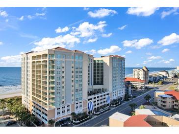 Beautiful condo building on a bright, sunny day near the ocean, with easy access to a busy street at 603 S Ocean Blvd. # 1101, North Myrtle Beach, SC 29582
