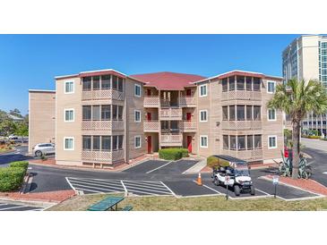 Attractive condo complex with multiple balconies, well maintained landscaping, and ample parking spaces at 609 Hillside Dr. S # C-16, North Myrtle Beach, SC 29582