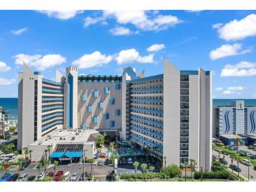 Beautiful exterior of a condo building with a blue sky background at 7100 N Ocean Blvd. # 317, Myrtle Beach, SC 29572