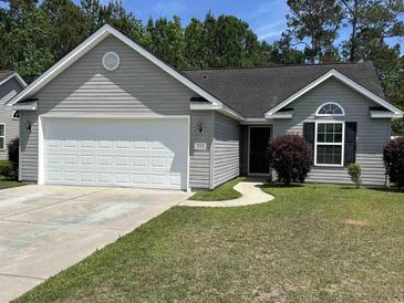 Charming single-story home with gray siding, attached garage, and well-maintained lawn at 753 Bucklin Loop, Myrtle Beach, SC 29579