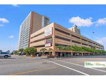 Exterior view of Sands Ocean Club featuring expansive parking and a tall building along the coastline at 9550 Shore Dr. # 226, Myrtle Beach, SC 29572