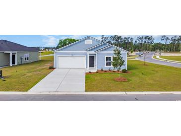 Charming single Gathering home with blue siding, manicured lawn and a concrete driveway at 1368 Palm Springs Paloma Dr, Longs, SC 29568