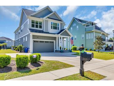Charming two-story home boasts a manicured lawn and inviting curb appeal at 260 Palmetto Harbour Dr., North Myrtle Beach, SC 29582