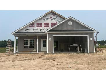 New construction gray home featuring an attached two-car garage and covered porch at 3597 Valley Forge Rd., Aynor, SC 29511