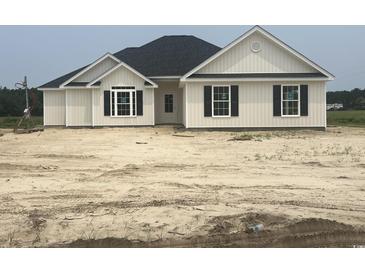 New construction home features a black roof and white siding, with black shutters at 3601 Valley Forge Rd., Aynor, SC 29511