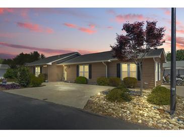 Charming home featuring a landscaped front yard, concrete driveway, and well-maintained exterior, perfect for suburban living at 634 Cypress Ln., North Myrtle Beach, SC 29582