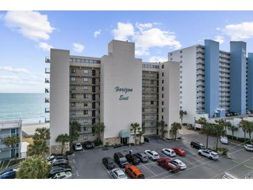 Horizon East beachfront condo complex featuring multiple floors, parking, and ocean views at 1108 N Waccamaw Dr. # C-4, Garden City Beach, SC 29576