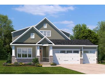 Charming two-story home with an attached two car garage and landscaped front yard, with a mix of brick and siding at 2214 Vera Way, Longs, SC 29568