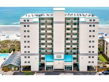 Beautiful condo building overlooking the beach with an outdoor pool and covered parking at 2507 S Ocean Blvd. S, North Myrtle Beach, SC 29582
