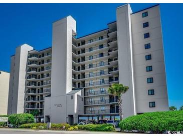 The Beach Club condo building featuring multiple balconies with ocean views and well-manicured landscaping at 3601 S Ocean Blvd. # 8-C, North Myrtle Beach, SC 29582