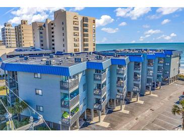 Coastal condo complex featuring private balconies with ocean views and on-site parking at 6000 N North Ocean Blvd. # 329, North Myrtle Beach, SC 29582