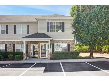 Inviting two-story home featuring a covered entrance and well-maintained landscaping at 10970 Highway 90 # A5, Little River, SC 29566