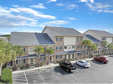 Well-maintained condo with parking and beautiful landscaping, perfect for comfortable coastal living at 205 Double Eagle Dr. # C-2, Myrtle Beach, SC 29575