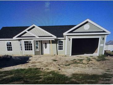 Charming single-story home with sage green siding, a modern garage, and a classic white front door at 2186 Mineral Springs Rd., Conway, SC 29527