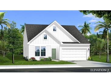 Charming two-story home with a two-car garage, white siding, green door, and a well-manicured lawn at 440 Sun Colony Blvd., Longs, SC 29568