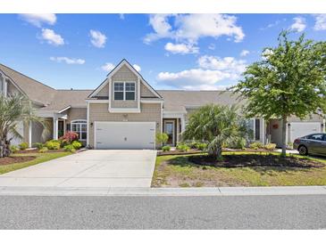 Charming home featuring an attached garage, well-manicured lawn, and mature landscaping at 5485 Elba Way # 5485, Myrtle Beach, SC 29579