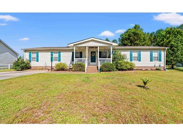 Charming single-story home with a well-manicured lawn and welcoming front porch at 7012 Walden Ct., Myrtle Beach, SC 29588