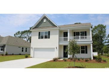 Charming two-story home boasts white siding, a welcoming porch, and an attached garage at 7088 Shooting Star Way, Myrtle Beach, SC 29579