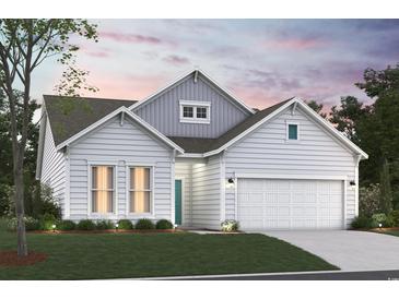 Charming, light gray two-story home featuring an attached two-car garage, manicured lawn, and well-maintained landscaping at 912 Inlet Keys St., Murrells Inlet, SC 29576