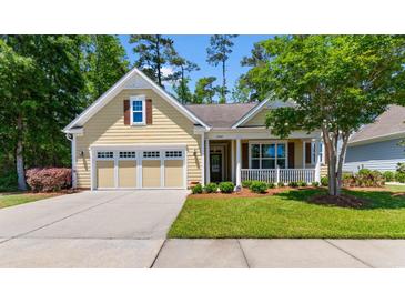 Charming single-Gathering home featuring a well-manicured lawn and an attached two-car garage at 2089 Suncrest Dr., Myrtle Beach, SC 29577