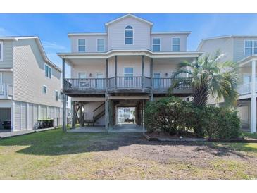 Three story beach house with covered decks, ground floor parking, and easy beach access at 48 Sw Wilmington St., Ocean Isle Beach, NC 28469