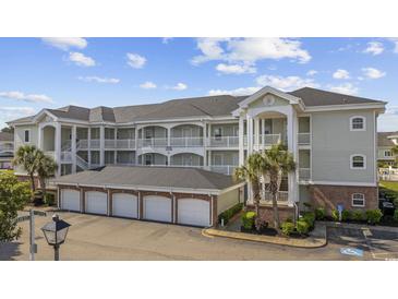 Coastal-style condo complex featuring multiple stories, private balconies and a convenient ground-level garage at 4860 Carnation Circle # 302, Myrtle Beach, SC 29577