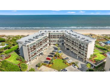 Stunning aerial view of the beachfront condo complex with a pristine sandy beach and ocean backdrop at 645 Retreat Beach Circle # A-2-C, Pawleys Island, SC 29585