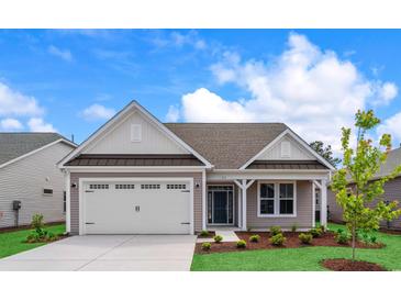 Charming single-story home with a two-car garage and well-maintained landscaping at 367 Broughton Dr., Myrtle Beach, SC 29579