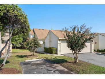 Charming home featuring well-maintained landscaping, and an attached two-car garage, perfect for suburban living at 4046 Fairway Lakes Dr. # 4046, Myrtle Beach, SC 29579