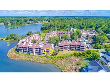 Waterfront condo with beautiful views of the lake and lush green landscape in a serene setting at 501 Maison Dr. # F8, Myrtle Beach, SC 29572