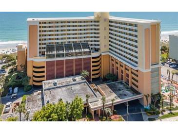 Beautiful exterior view of a resort with beach access and covered parking area at 6900 Ocean Blvd. # 935, Myrtle Beach, SC 29572