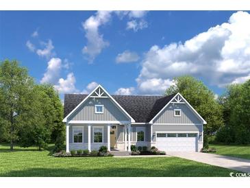 Charming single-story home with gray siding, white trim, attached two-car garage and manicured lawn at 7031 Denim Loop, Myrtle Beach, SC 29579