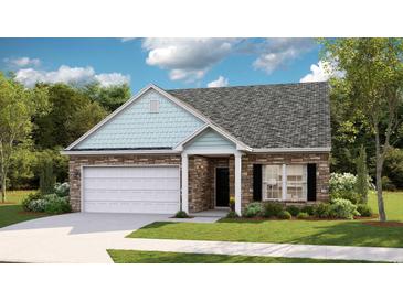Charming single-Gathering home featuring stone accents, light blue shingle details and an attached two-car garage at 8719 Baton Rouge Ave Nw, Calabash, NC 28467