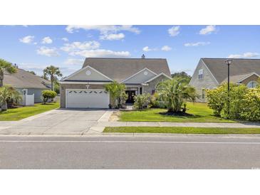 Charming single-story home with a well-manicured lawn and a two-car garage at 886 Carolina Farms Blvd., Myrtle Beach, SC 29579