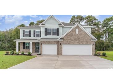 Charming two-story home featuring a brick facade, attached two-car garage, and manicured lawn at 889 Ireland Dr., Longs, SC 29568