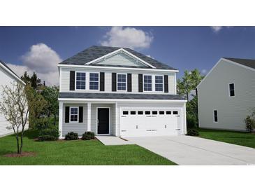 Charming two-story home with a two-car garage and well-maintained landscaping at 261 Mayflower Dr., Calabash, NC 28467