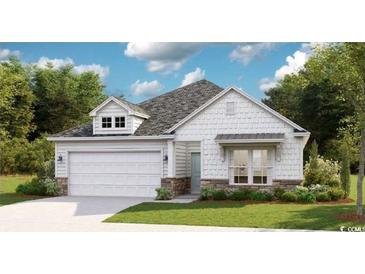 Charming single-Gathering home with stone accents, a two-car garage, and a well-manicured lawn at 527 Magnolia Terrace Dr, Myrtle Beach, SC 29579