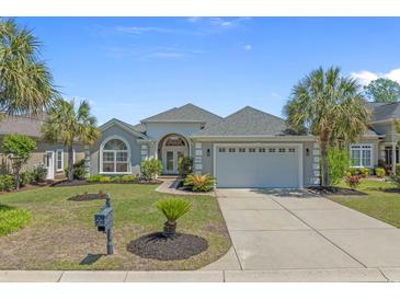 Charming single story home boasts a well manicured lawn, paved driveway and large garage at 631 Edgecreek Dr., Myrtle Beach, SC 29579
