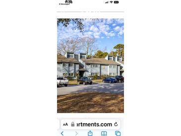 A daytime view of the exterior of this condo with multiple cars parked outside of it at 10301 N Kings Hwy. # 22-11, , SC 29572